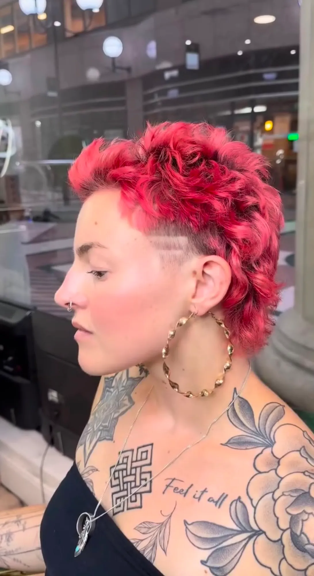 Red pixie crop with a shaved side design