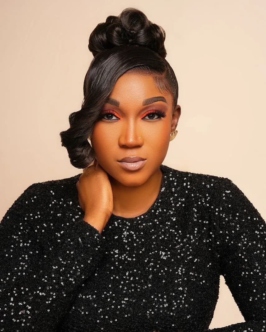 A Hair Talks by Ray client with a glamorous styled updo