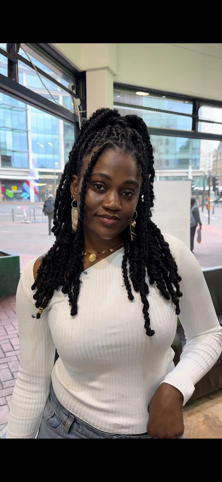 Shoulder-length distressed butterfly locs